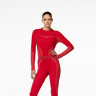 Person wearing a red outfit with cut-out design on a white background