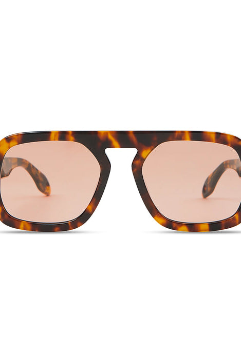 Sunglasses with tortoiseshell frame and pink lenses on a white background